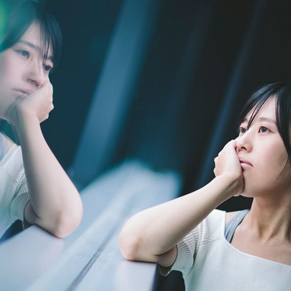 woman looking out of window