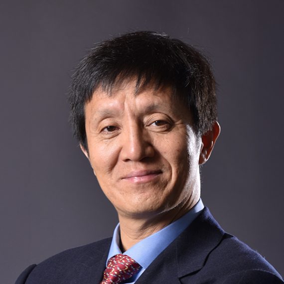 Horizontal portrait of Liqun Luo in a jacket and tie.